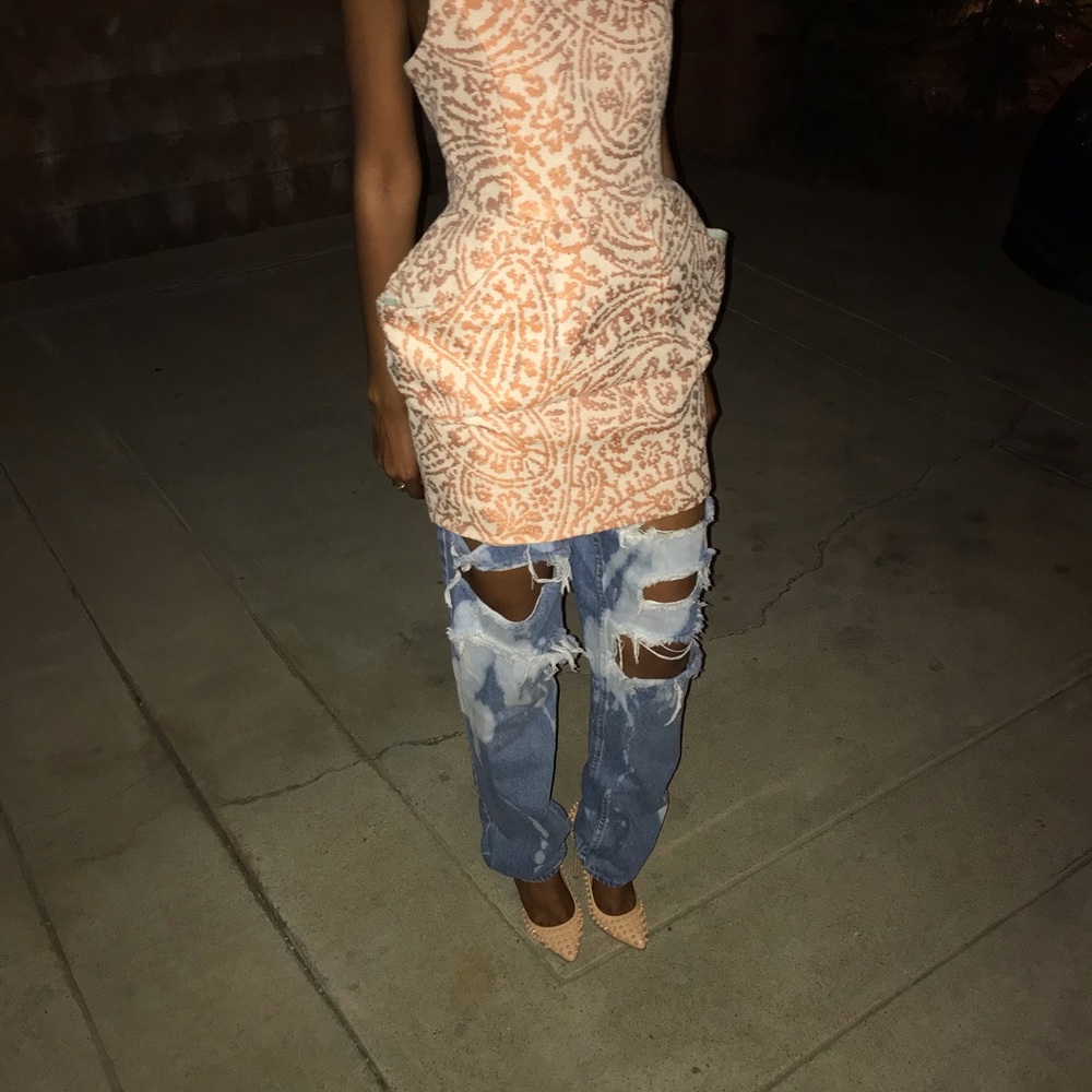 Spiked (pigalle louboutin look) nude pumps.